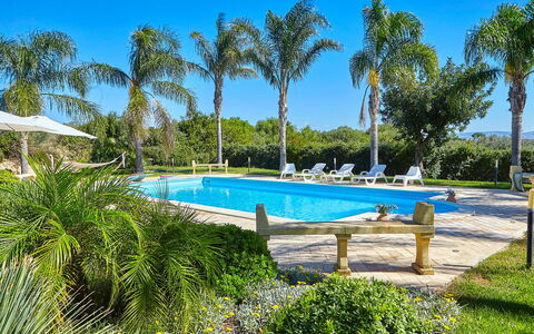 Villa Selinunte: Water, Plant, Sky, Swimming Pool, Tree, Arecales, Shade, Leisure, Outdoor Furniture, Landscape