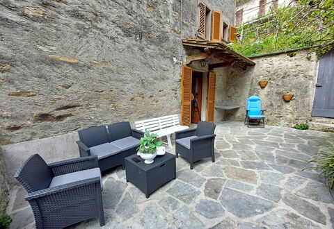 Casa Le Grotte: Plant, Building, Window, Flowerpot, Houseplant, Couch, Architecture, Outdoor Furniture, Road Surface, House