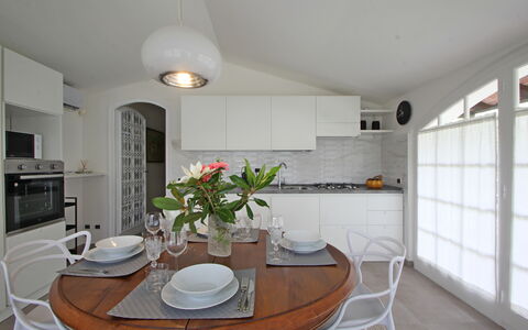Villa Di Magra: Property, Table, Furniture, White, Plant, Cabinetry, Wood, Lighting, Interior Design, Flower