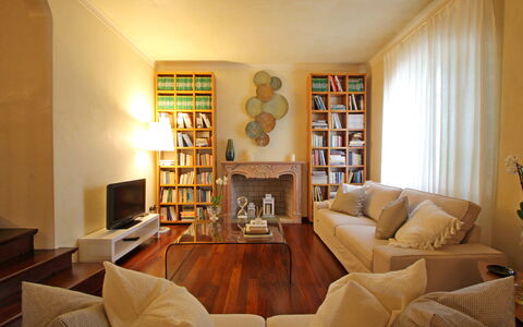 Villa Di Magra: Brown, Furniture, Property, Bookcase, Picture Frame, Shelf, Couch, Wood, Shelving, Living Room