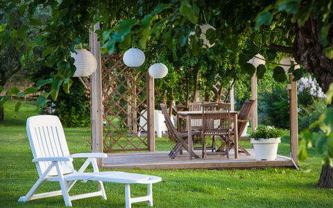 Villa Angelica: Plant, Furniture, Table, Chair, Green, Outdoor Table, Tree, Outdoor Furniture, Shade, Grass