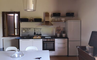 Andromeda: Cabinetry, Furniture, Countertop, Sink, Kitchen, Wood, Home Appliance, Lighting, Kitchen Stove, Architecture