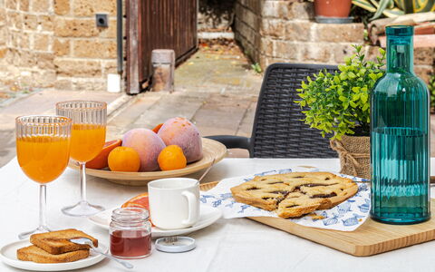 Cyca Holiday Home: Food, Table, Tableware, Plant, Bottle, Dishware, Plate, Ingredient, Wood, Orange
