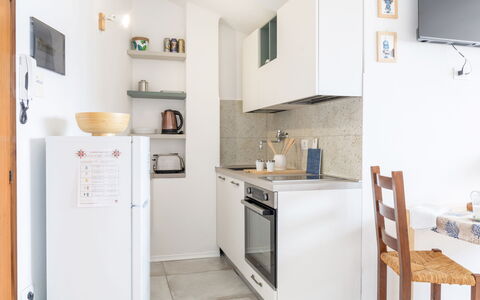 Conero Bluloft: Kitchen, Furniture, Major Appliance, Kitchen Appliance, Countertop, Interior Design, Wood, Flooring, Cabinetry, Floor