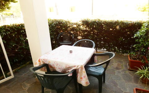 Casa Vacanze Sabrina: Plant, Furniture, Table, Wood, Outdoor Furniture, Chair, Floor, Grass, Flooring, Building