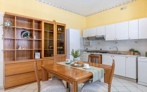 Suite Oltremare: Cabinetry, Furniture, Table, Houseplant, Plant, Countertop, Wood, Couch, Building, Interior Design