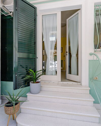 Suite Oltremare: Plant, Flowerpot, Houseplant, Building, Azure, Stairs, Interior Design, Door, Wood, Floor