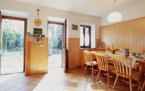 Baita a Pieve Tesino Mountain And Lake: Furniture, Property, Table, Cabinetry, Chair, Door, Window, Plant, Wood