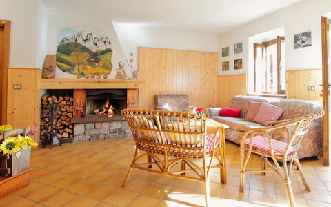 Baita a Pieve Tesino Mountain And Lake: Furniture, Property, Table, Wood, Textile, Interior Design, Comfort, Chair, Orange, Architecture