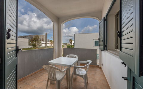 Andromeda Apartment In Gallipoli: Sky, Property, Furniture, Table, Cloud, Chair, Building, Wood, Window, Interior Design