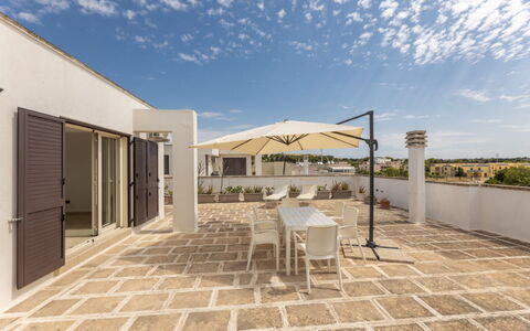Loft San Giovanni in Gallipoli: Flooring, Floor, Tile, Flagstone, Design, Chair, Houseplant, Kitchen & Dining Room Table, Courtyard