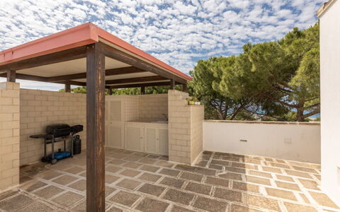 Loft San Giovanni in Gallipoli: Wood, Floor, Flooring, Composite Material, Shade, Wood Stain, Outdoor Structure, Concrete, Tile, Pergola