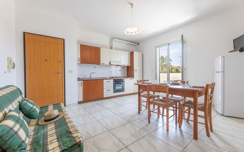 Apartment Balcony Sea View - Gallipoli: Table, Furniture, Cabinetry, Couch, Window, Wood, Chair, Interior Design, Flooring, Floor