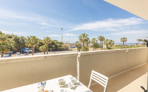 Apartment Balcony Sea View - Gallipoli: Sky, Cloud, Furniture, Property, Table, Tableware, Tree, Chair, Shade, Architecture