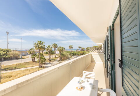 Apartment Balcony Sea View - Gallipoli: Sky, Cloud, Property, Plant, Building, Shade, Tree, House, Real Estate, Arecales