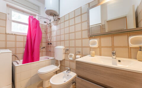 Apartment Living In Baia Verde - Gallipoli: Tap, Plumbing Fixture, Mirror, Bathroom Sink, Sink, Bathroom Cabinet, Property, Building, Purple, Bathroom