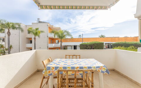 Apartment Living In Baia Verde - Gallipoli: Sky, Table, Cloud, Property, Building, Azure, Chair, Shade, Interior Design, Architecture