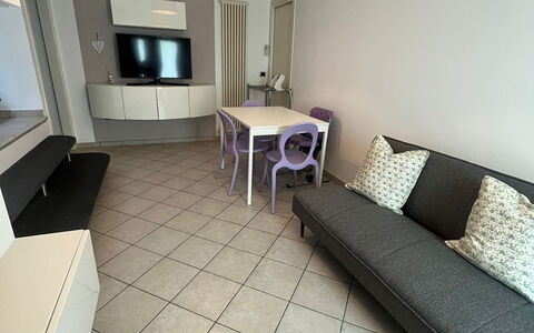 Bell'aria Apartment: Furniture, Property, Couch, Table, Cabinetry, Interior Design, Wood, Flooring, Building, Floor