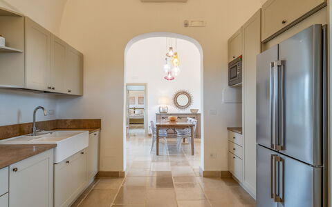 Villa Monamu: Kitchen Sink, Cabinetry, Sink, Furniture, Property, Tap, Plumbing Fixture, Countertop, Wood, Building