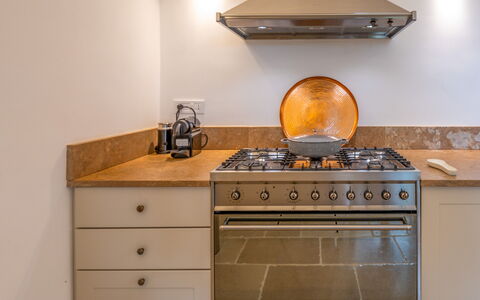 Villa Monamu: Cabinetry, Furniture, Countertop, Kitchen, Wood, Kitchen Stove, Drawer, Kitchen Appliance, Cooktop, Floor