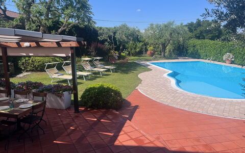 Villapronti: Plant, Water, Sky, Shade, Outdoor Furniture, Tree, Swimming Pool, Flowerpot, Table, Landscape