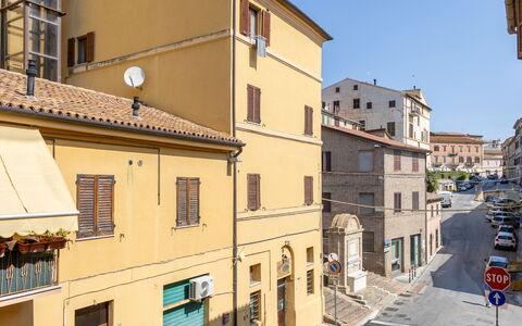 Loreto Suite Apartment: Building, Window, Sky, Urban Design, House, Facade, City, Vehicle, Roof
