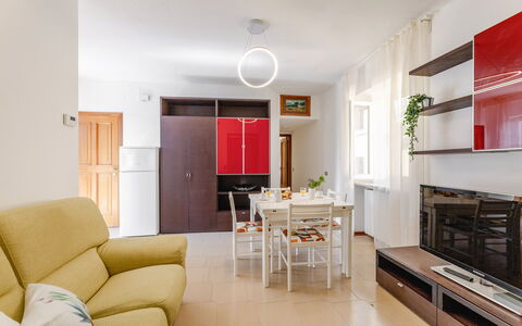 Loreto Suite Apartment: Furniture, Couch, Table, Interior Design, Orange, Wood, Building, Comfort, Flooring, Floor