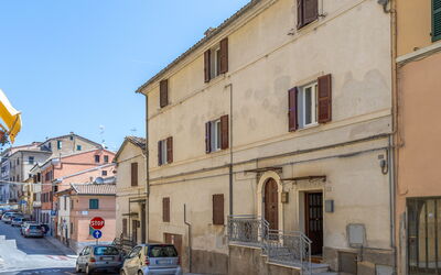 Loreto Suite Apartment: Building, Sky, Wheel, Property, Car, Window, Infrastructure, Vehicle, House