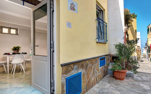 Casetta Di Laura In Massa Lubrense: Plant, Building, Flowerpot, Houseplant, Window, Wood, Yellow, Flooring, Residential Area, Road Surface