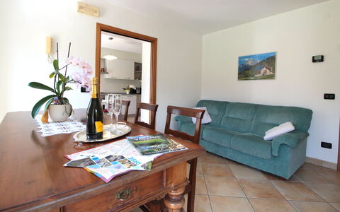 Apartment With Garden, Del Corlo Lake, Belluno: Table, Furniture, Picture Frame, Property, Plant, Couch, Green, Flower, Interior Design, Wood