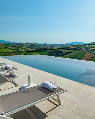 Relais Tenuta Santori: Sky, Building, Water, Outdoor Furniture, Urban Design, Condominium, Tree, Residential Area, Landscape, Swimming Pool