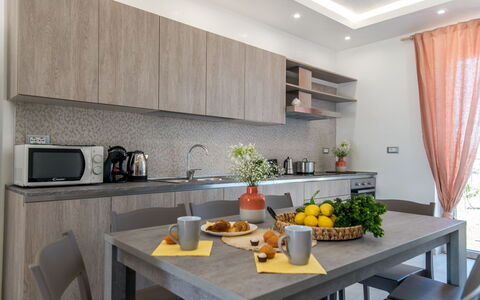 Villa Normanni: Table, Countertop, Property, Cabinetry, Furniture, Tableware, Kitchen, Interior Design, Wood, Lighting
