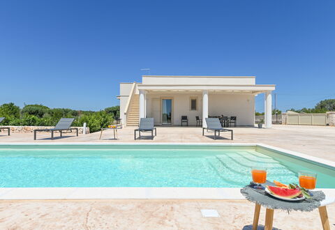 Villa Normanni: Sky, Property, Water, Azure, Shade, Leisure, Rectangle, Grass, Tree, Real Estate