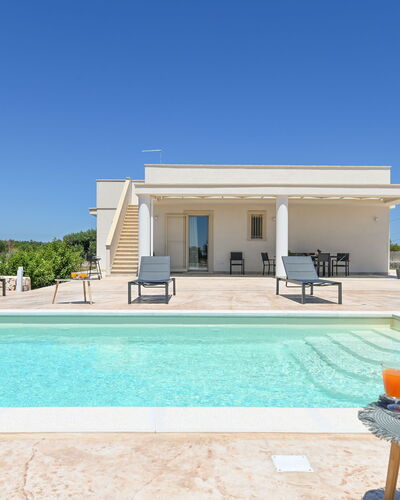 Villa Normanni: Sky, Property, Water, Azure, Shade, Leisure, Rectangle, Grass, Tree, Real Estate