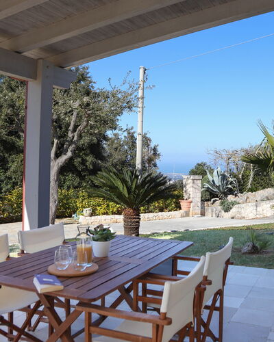 Villa Don Sante In Locorotondo Puglia: Plant, Table, Furniture, Property, Sky, Chair, Azure, Shade, Lighting, Tree