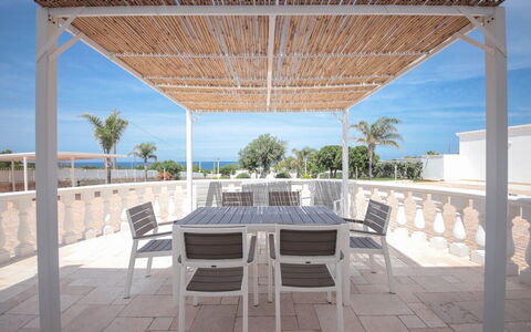 Villa Azzurra Seaview In Monopoli, Puglia: Sky, Furniture, Property, Table, Chair, Shade, Outdoor Furniture, Interior Design, Tree, Wood