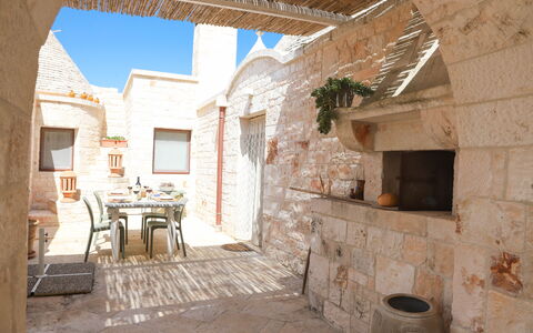 Country Trullo Rosso With Jacuzzi Alberobello: Window, Building, Sky, Table, Plant, Brick, Interior Design, Chair, Brickwork, Wood
