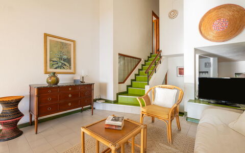 Capo Boi: Table, Furniture, Building, Property, Picture Frame, Plant, Wood, Houseplant, Interior Design, Lighting