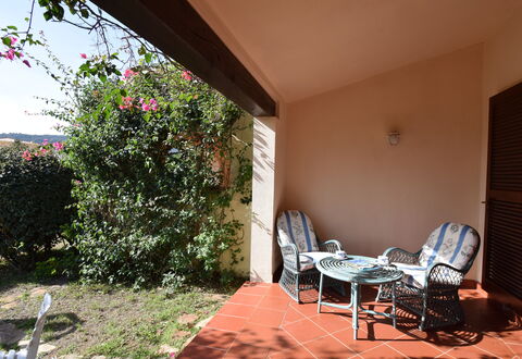 Casa Ortensia With Garden Budoni: Plant, Property, Building, Furniture, Table, Chair, Shade, Flower, House, Floor