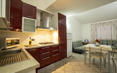 Trilocale Villa 3: Kitchen, Kitchen Appliance, Flooring, Interior Design, Major Appliance, Countertop, Wood, Floor, Furniture, Ceiling