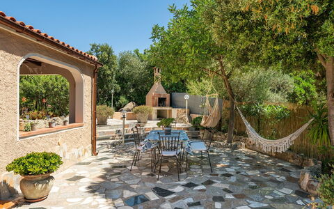 Doxina: Furniture, Flagstone, Outdoor Furniture, Chair, Garden, Patio, Backyard, Tile, Landscaping, Flowerpot