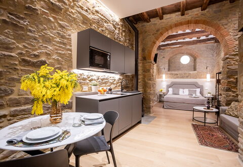 Maccari Suite: Interior Design, Furniture, Flooring, Living Room, Ceiling, Stone Wall, Couch, Chair, Light Fixture