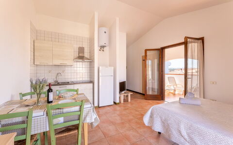 Casa Pavoncelle Apartments In Gallura: Apartment, Furniture, Floor, Chair, Ceiling, Kitchen & Dining Room Table, Balcony, Wood Stain, Porch, Villa