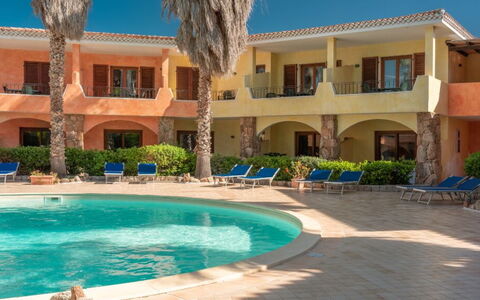 Casa D'orso Green Village Sardegna: Water, Plant, Building, Property, Window, Azure, Architecture, Tree, Sky, Leisure