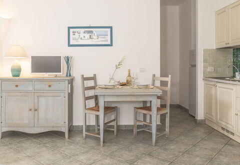 Casa D'orso Green Village Sardegna: Table, Cabinetry, Furniture, Property, Building, Desk, Drawer, Chair, Lighting, Computer Desk