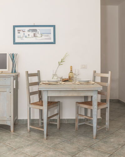 Casa D'orso Green Village Sardegna: Table, Cabinetry, Furniture, Property, Building, Desk, Drawer, Chair, Lighting, Computer Desk
