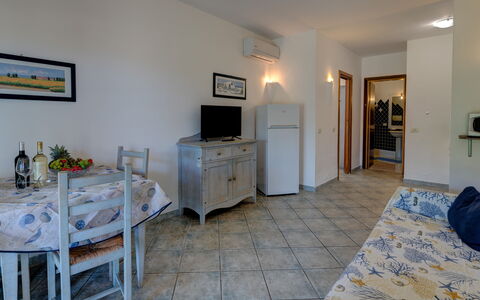 Casa Faro Green Village Sardegna: Cabinetry, Furniture, Picture Frame, Television, Blue, Building, Azure, Wood, Drawer, Window Blind