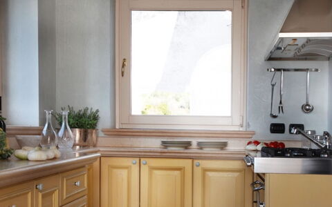 Villa Garda: Wood, Kitchen, Interior Design, Countertop, Home, Flooring, Kitchen Sink, Cabinetry, Kitchen Appliance, Tap