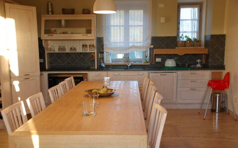 Villa Rufeno: Furniture, Flooring, Floor, Wood, Interior Design, Cabinetry, Countertop, Kitchen & Dining Room Table, Kitchen, Chair