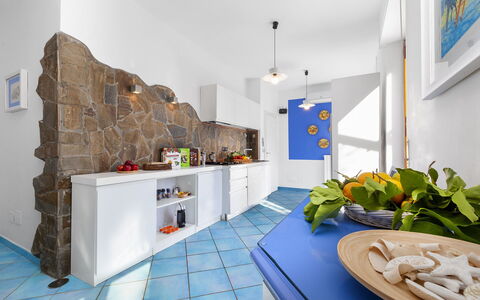 Villa Flora: Flooring, Interior Design, Ceiling, Floor, Kitchen, Countertop, Room, Apartment, Tile, Major Appliance